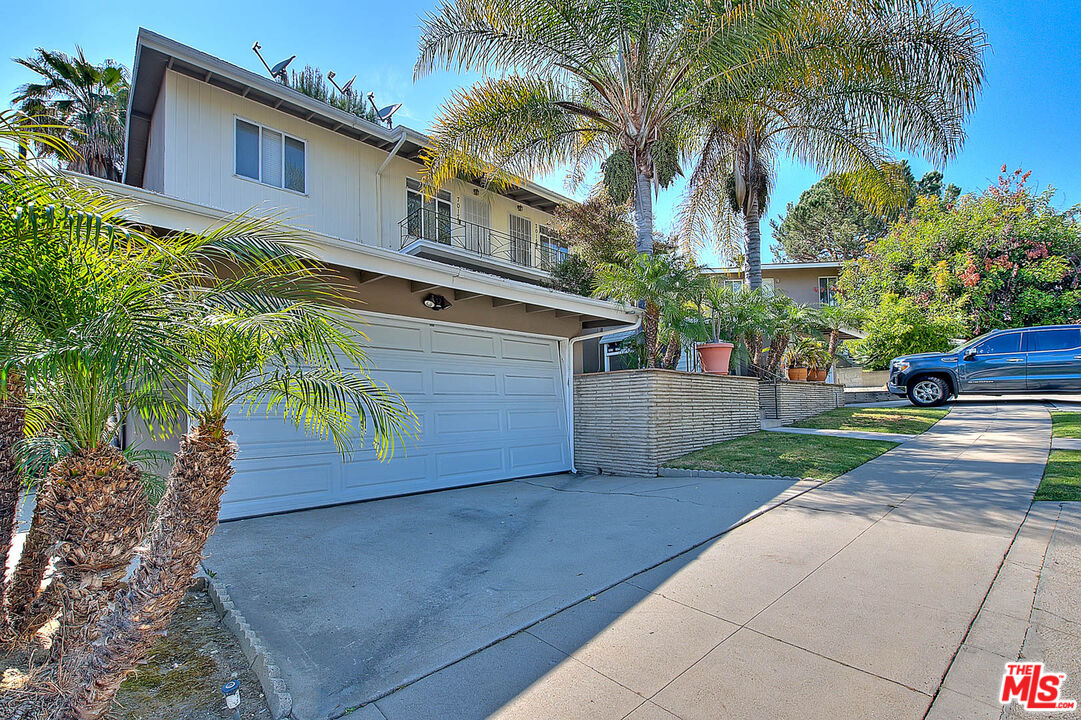 7017 Ramsgate Place Los Angeles, CA 90045 - Photo 2 of 32 a view of a yard with a house
