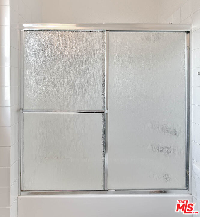 7017 Ramsgate Place Los Angeles, CA 90045 - Photo 27 of 32 a bathroom with a glass shower door