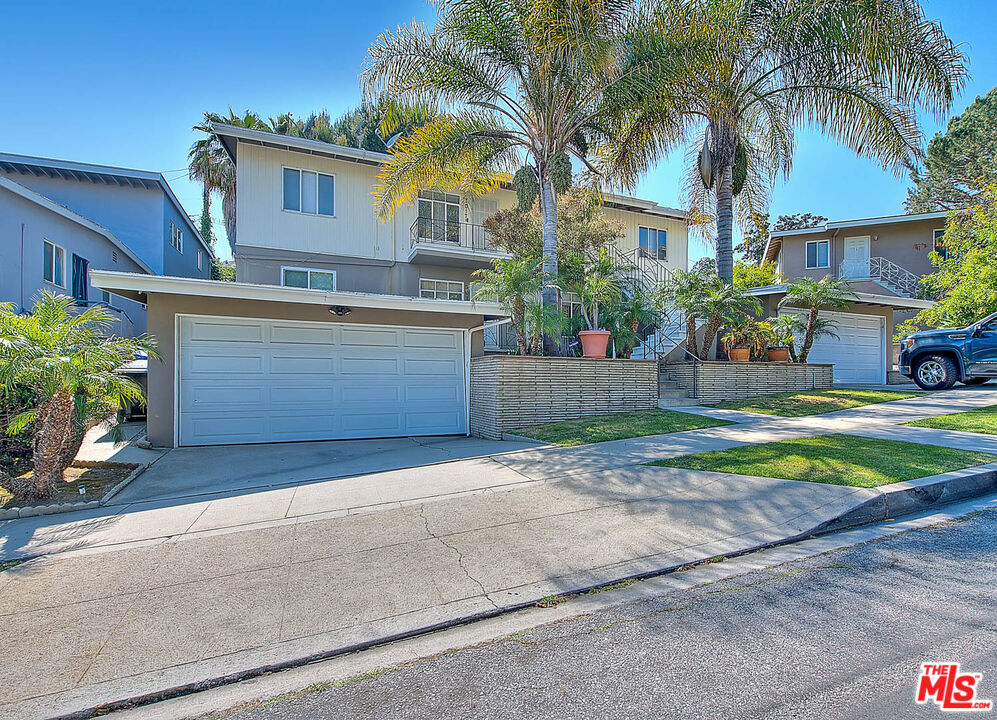 7017 Ramsgate Place Los Angeles, CA 90045 - Photo 3 of 32 a front view of a house with a yard and garage