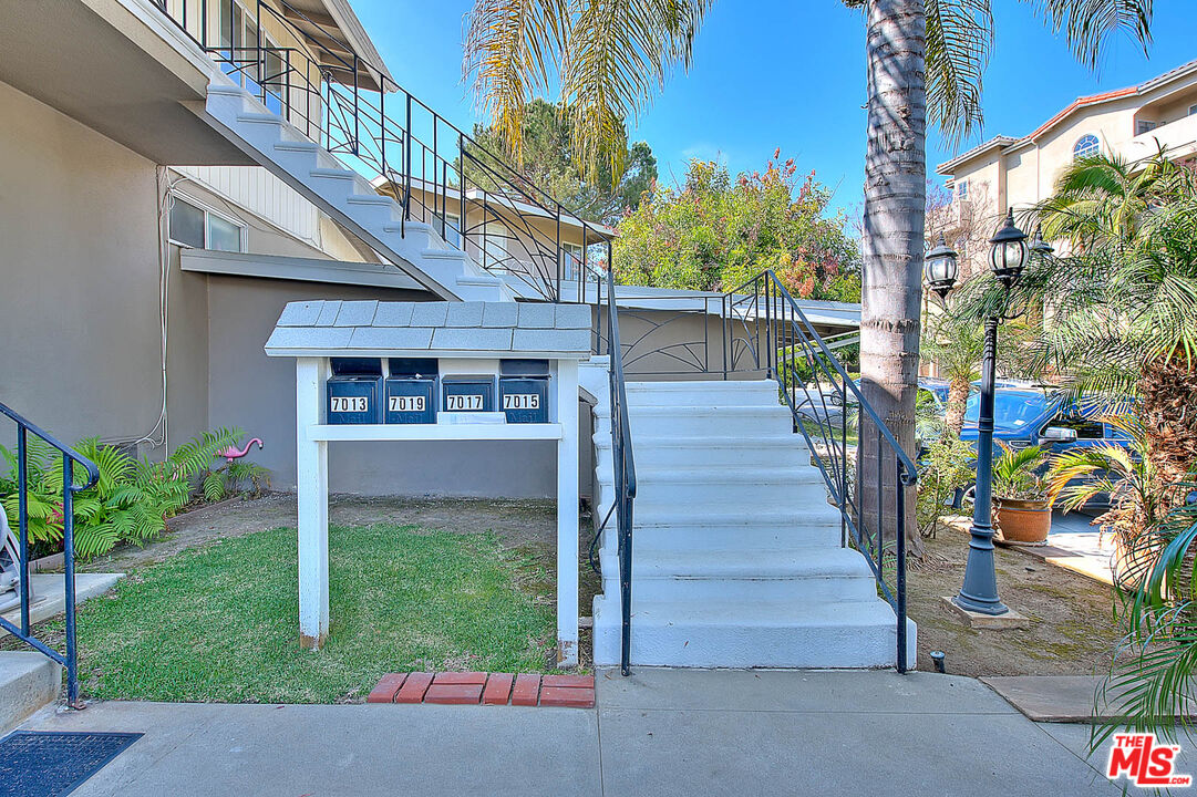 7017 Ramsgate Place Los Angeles, CA 90045 - Photo 4 of 32 a front view of a house with a yard