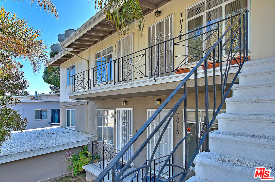 7017 Ramsgate Place Los Angeles, CA 90045 - Photo 5 of 32 a view of a house with wooden stairs and a table