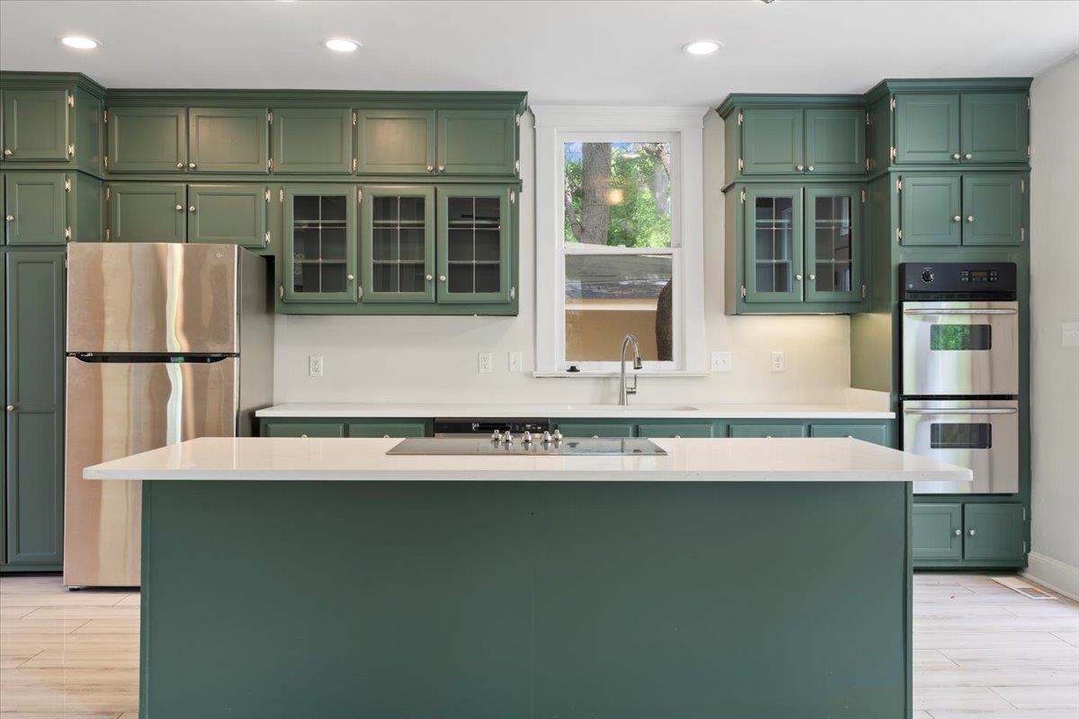 1682 Lawrence Avenue Memphis, TN 38112 - Photo 14 of 33 a kitchen with a refrigerator and a sink