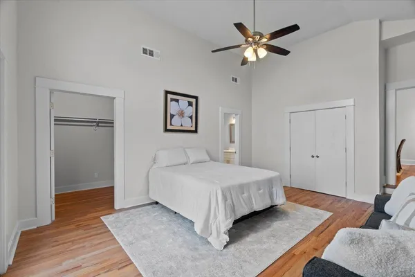 a bed room with a bed and a chandelier