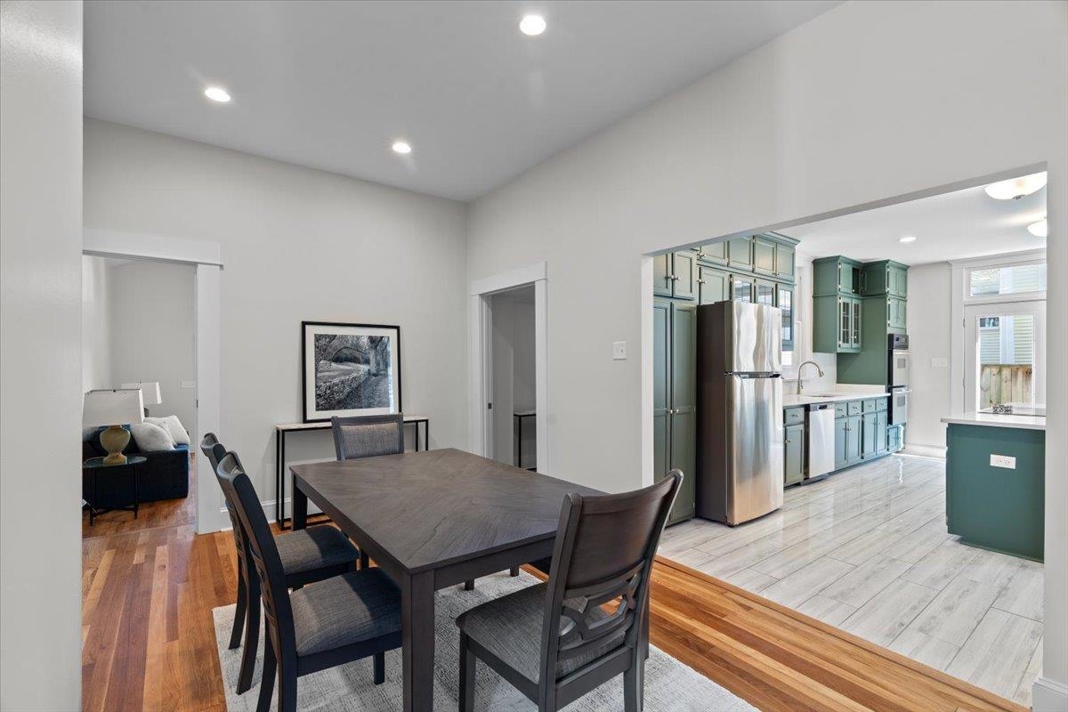 1682 Lawrence Avenue Memphis, TN 38112 - Photo 17 of 33 a dining room with furniture and wooden floor