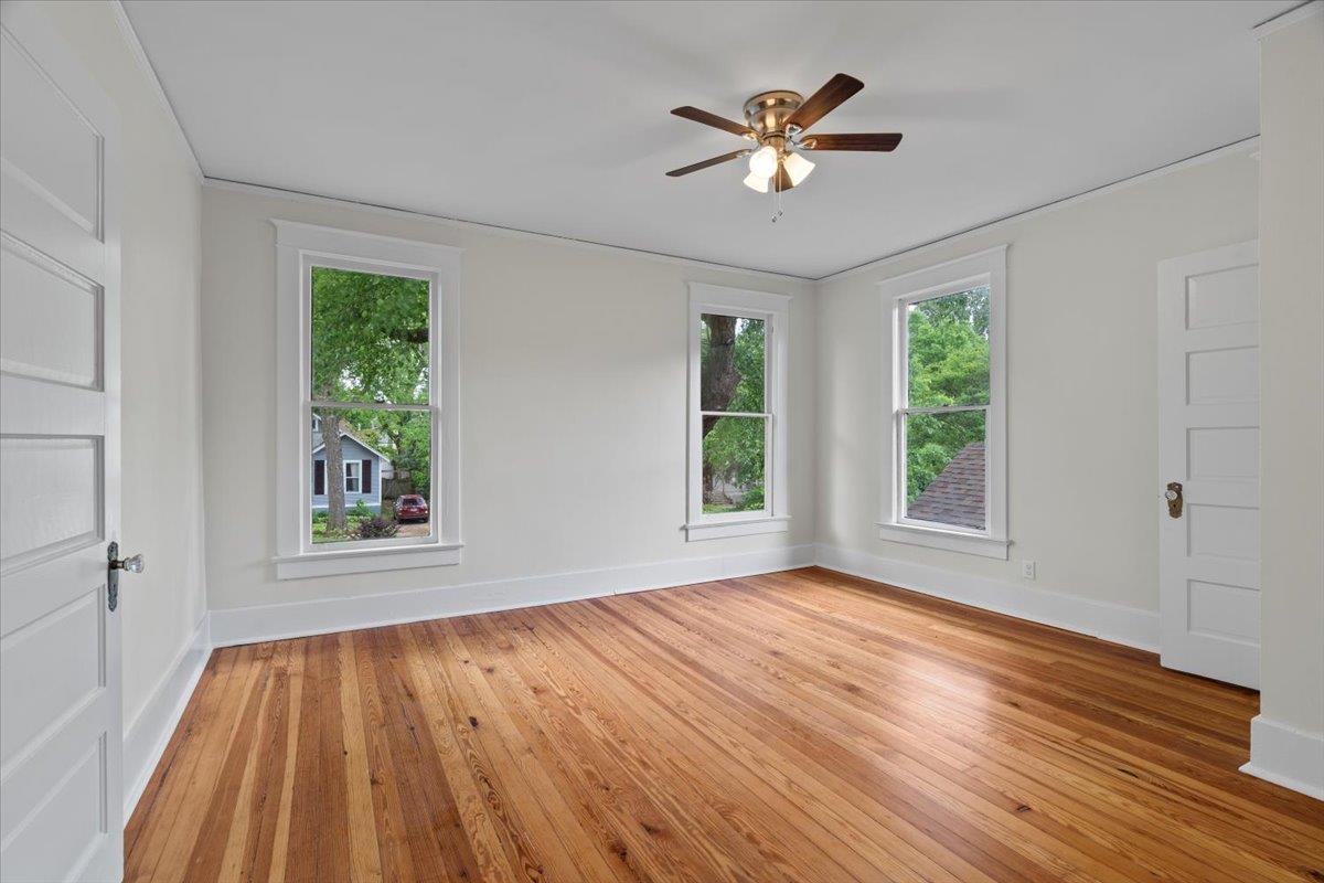 1682 Lawrence Avenue Memphis, TN 38112 - Photo 24 of 33 wooden floor in an empty room with a window
