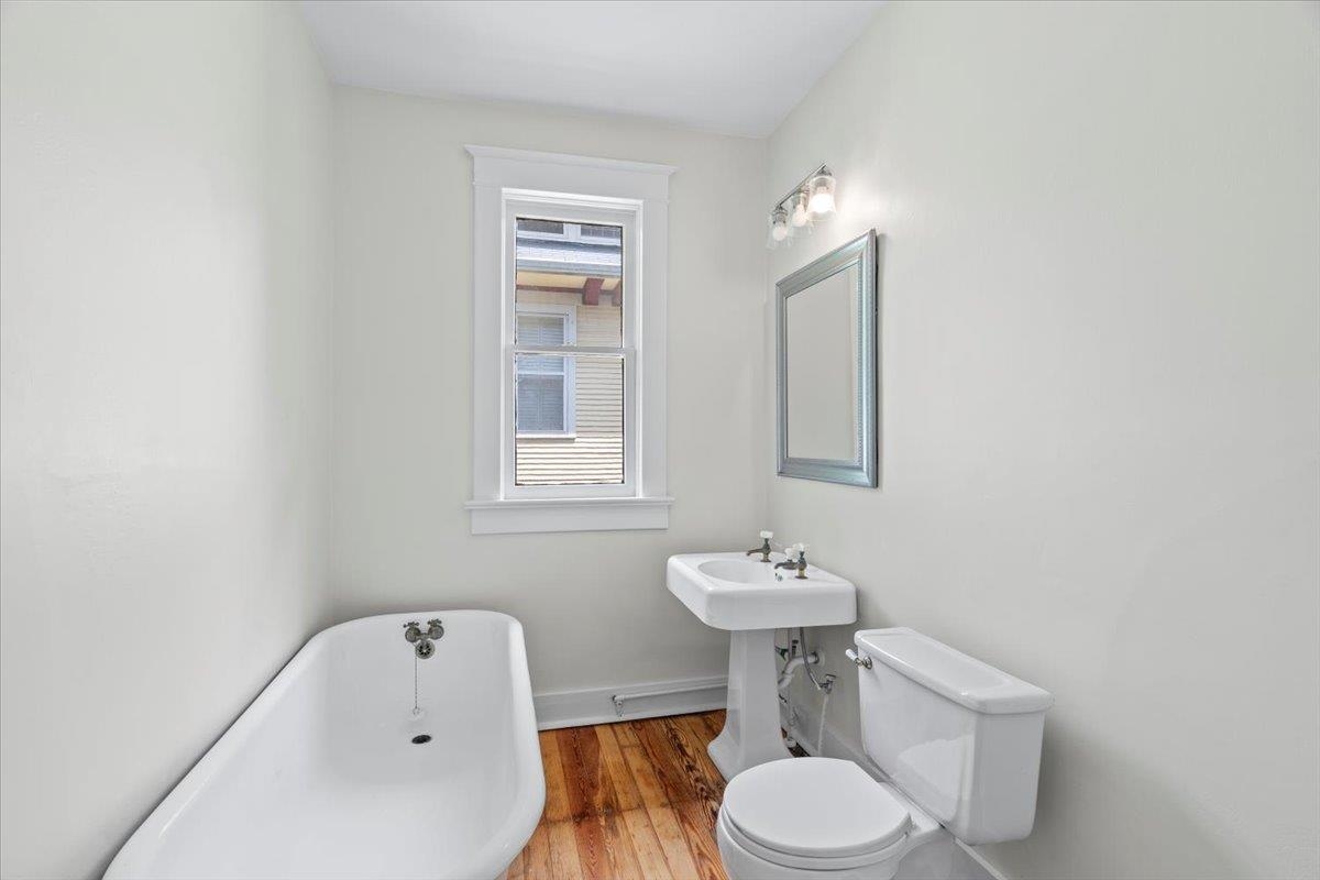 1682 Lawrence Avenue Memphis, TN 38112 - Photo 27 of 33 a bathroom with a sink toilet and a mirror