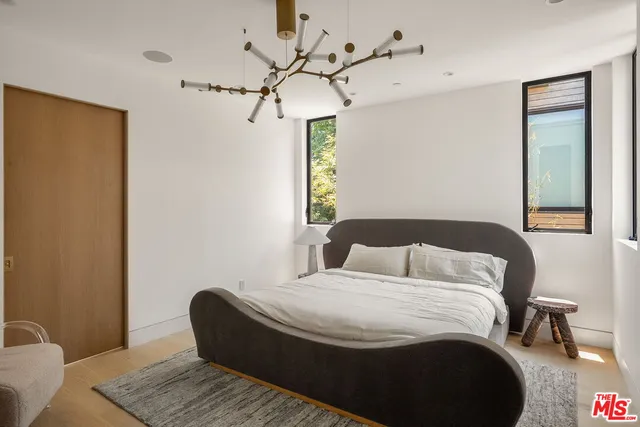 a bedroom with a bed and a table