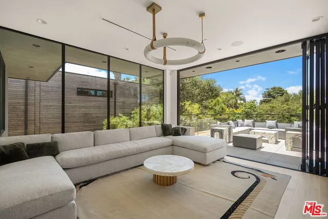 a living room with furniture and a table