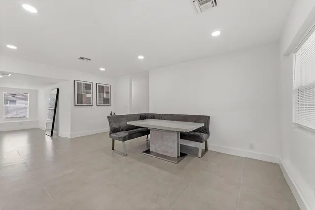 a room with furniture and wooden floor