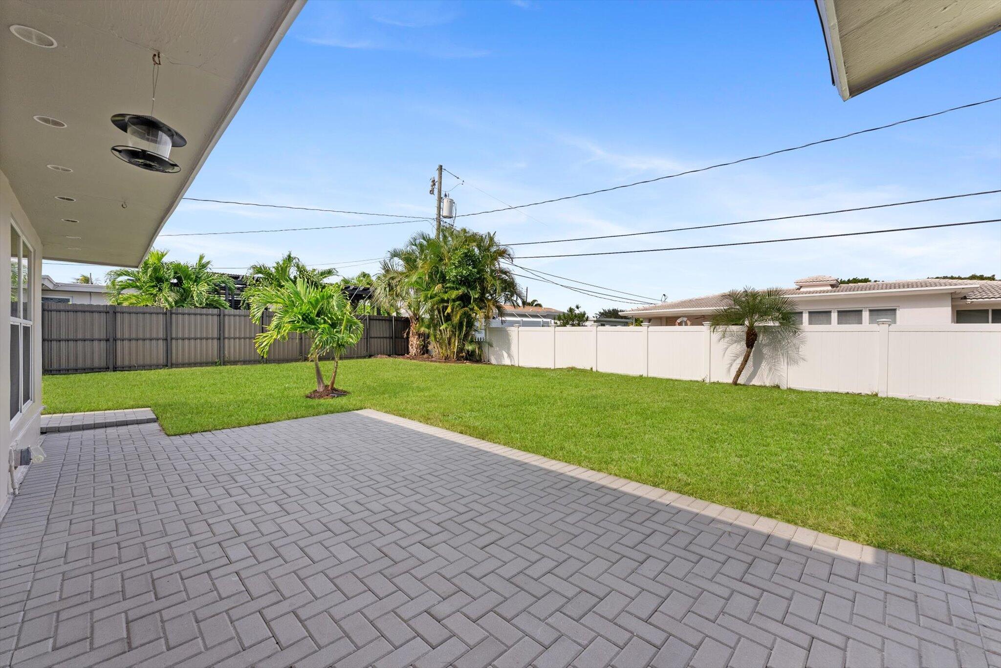 521 Northeast 32nd Street Boca Raton, FL 33431 - Photo 20 of 25 a view of a garden with a slide