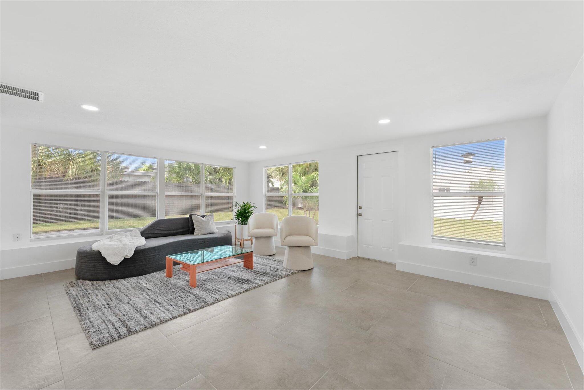 521 Northeast 32nd Street Boca Raton, FL 33431 - Photo 10 of 25 a living room with furniture and a window