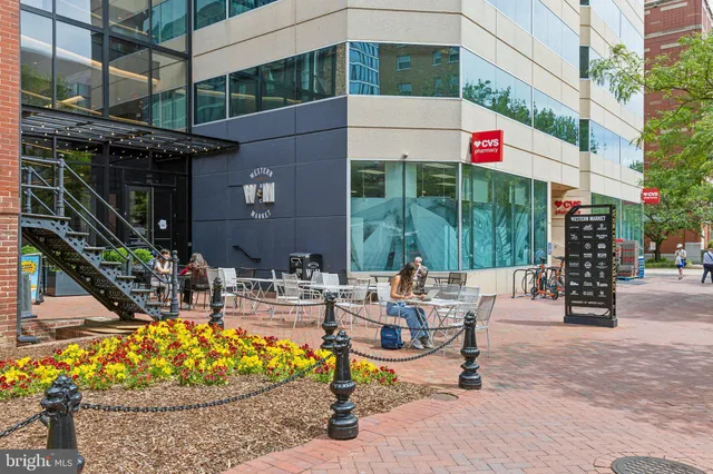a view of a building with garden and trees