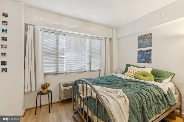 a bedroom with a bed and a chair