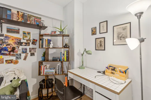 a view of a workspace with furniture and toys