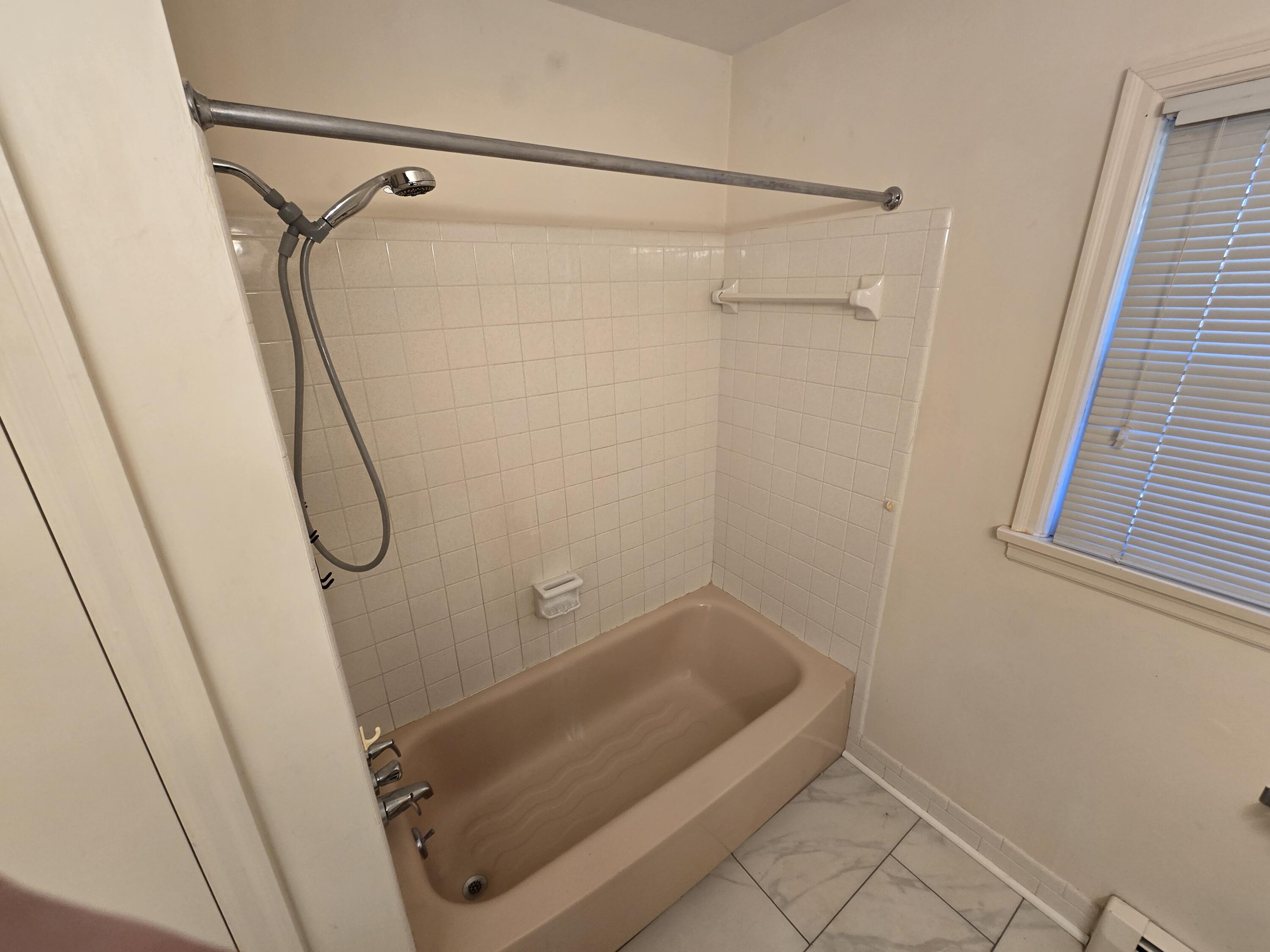 3714 Bandy Road Roanoke, VA 24014 - Photo 8 of 17 a bathroom with a glass shower door