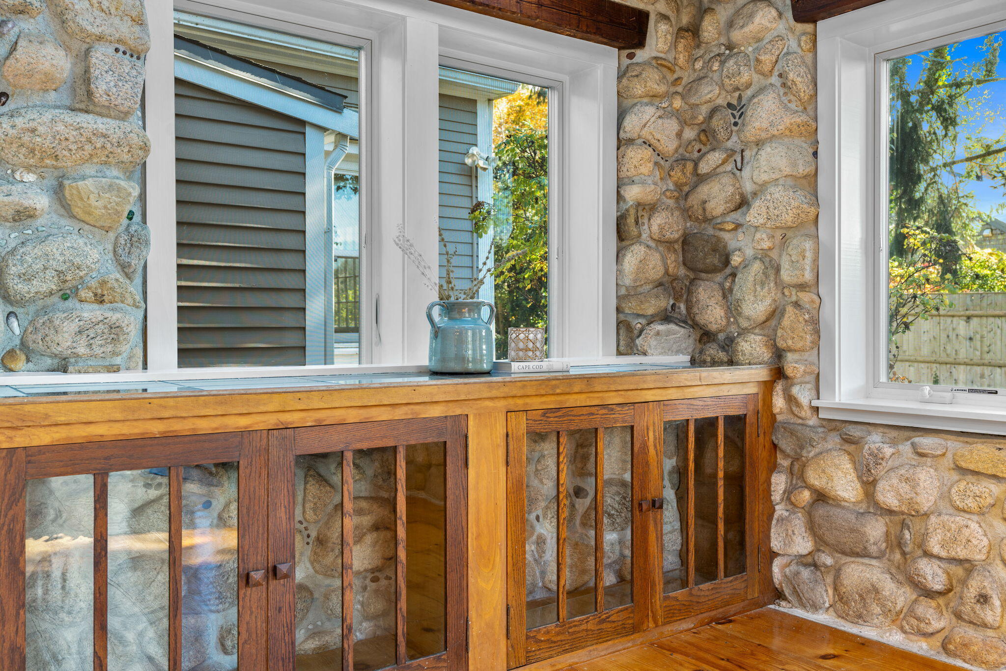 1208 County Road Cataumet, MA 02534 - Photo 14 of 40 a view of a brick house with large windows