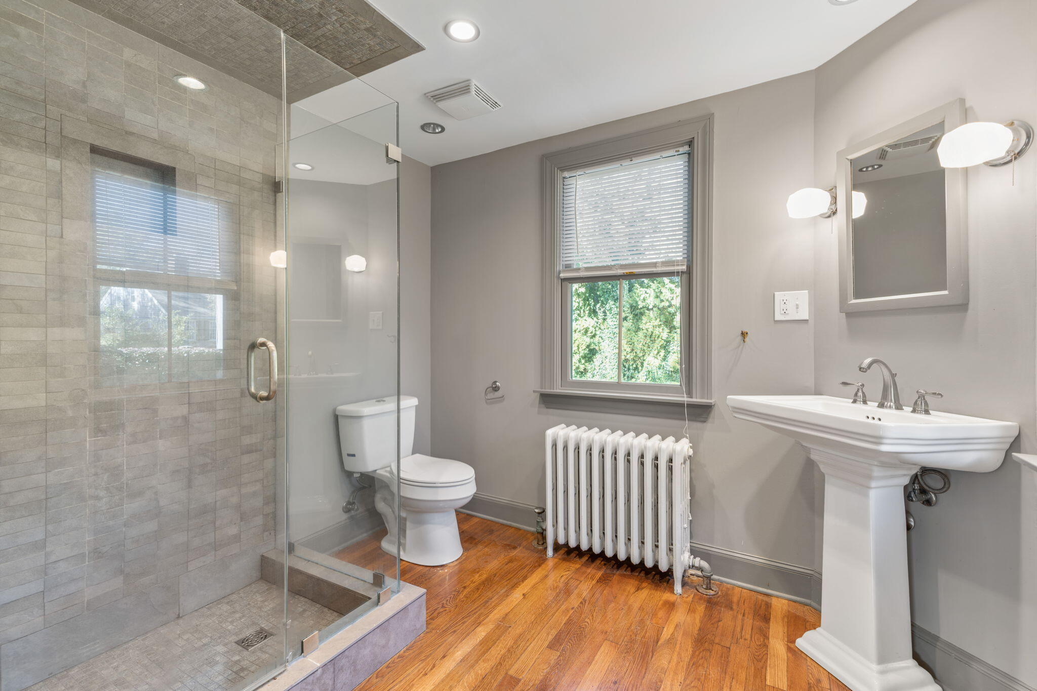 1208 County Road Cataumet, MA 02534 - Photo 20 of 40 a bathroom with a sink a toilet a mirror and shower