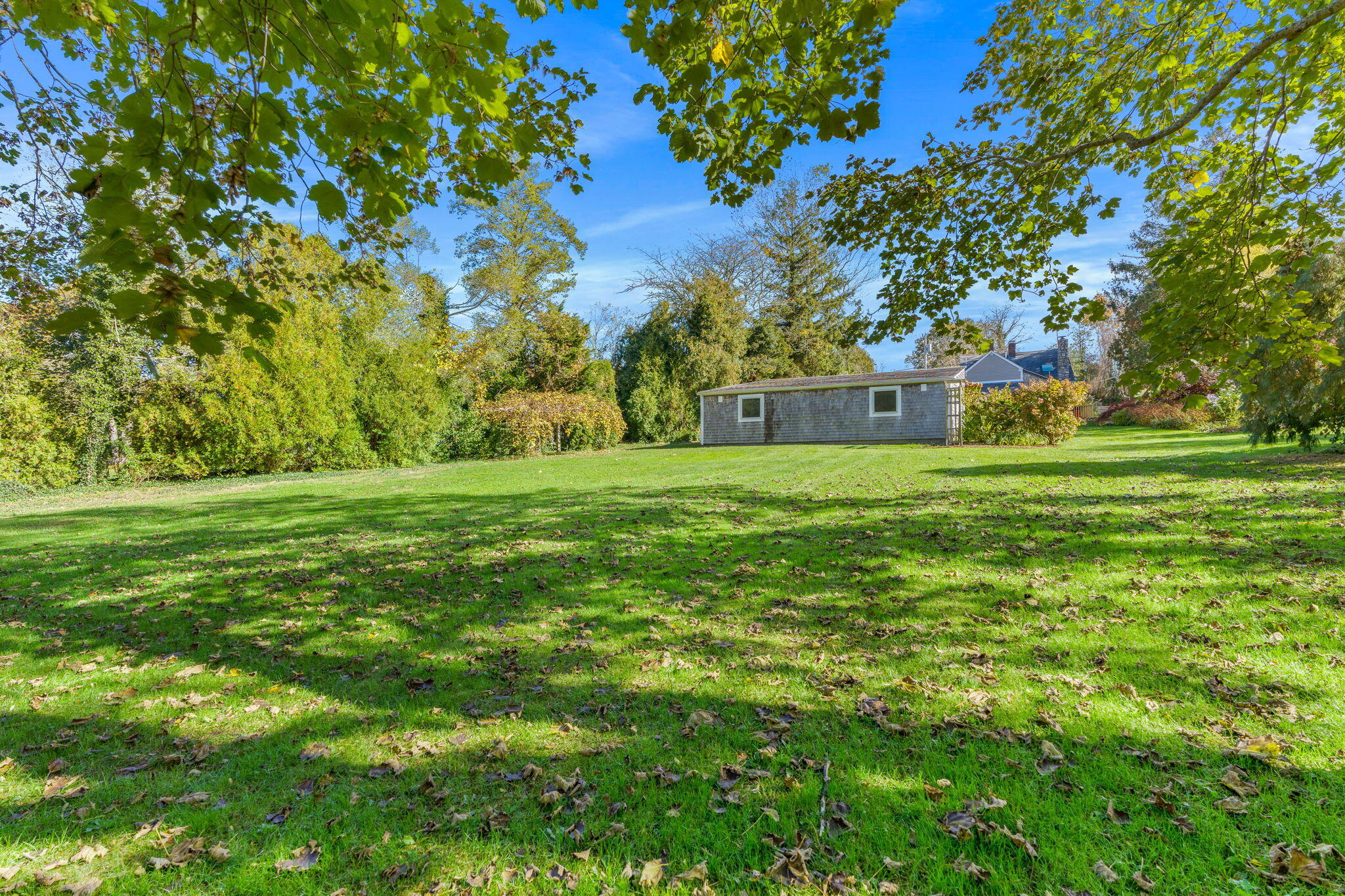 1208 County Road Cataumet, MA 02534 - Photo 29 of 40 a view of a grassy field with trees