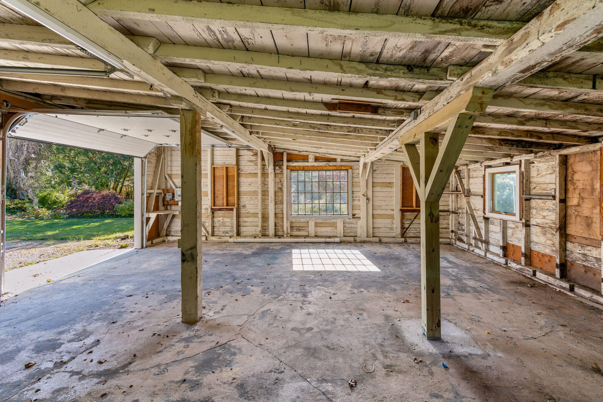 1208 County Road Cataumet, MA 02534 - Photo 32 of 40 a view of a porch with a table and chairs