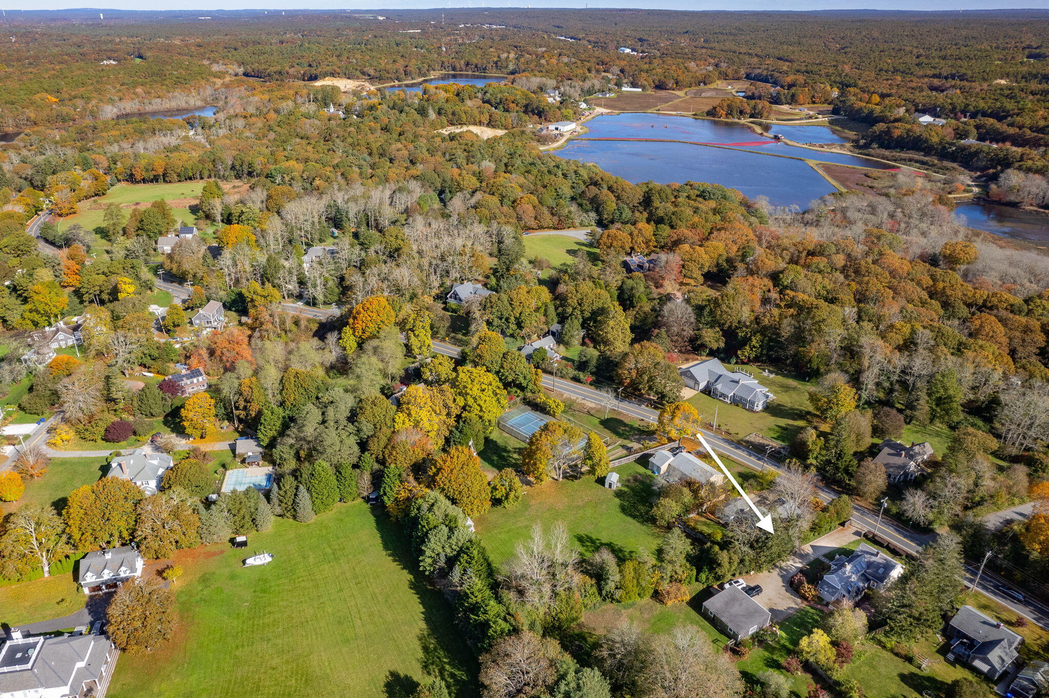1208 County Road Cataumet, MA 02534 - Photo 33 of 40 an aerial view of residential houses with outdoor space