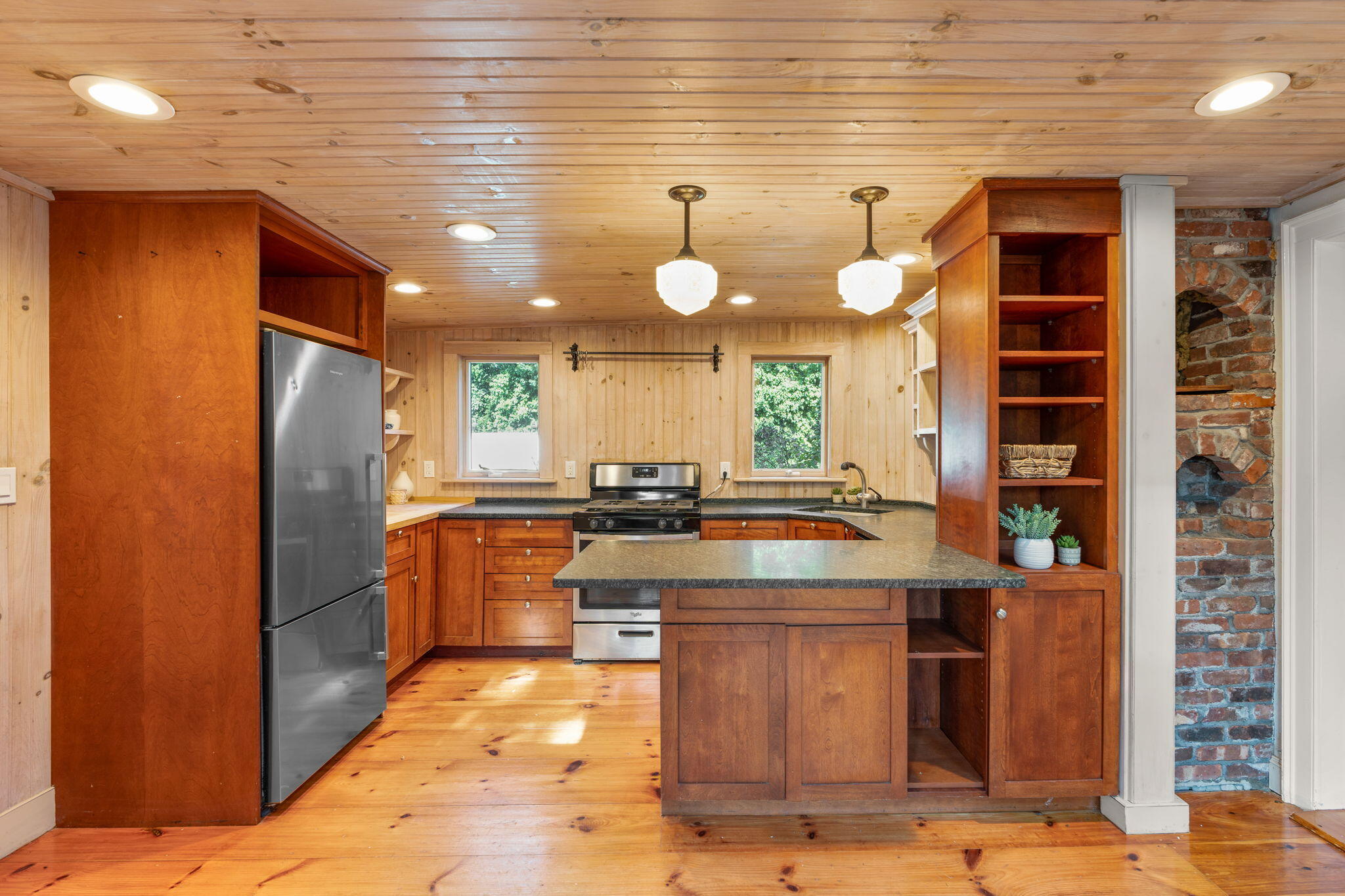 1208 County Road Cataumet, MA 02534 - Photo 7 of 40 a kitchen with stainless steel appliances granite countertop a stove a sink and a refrigerator