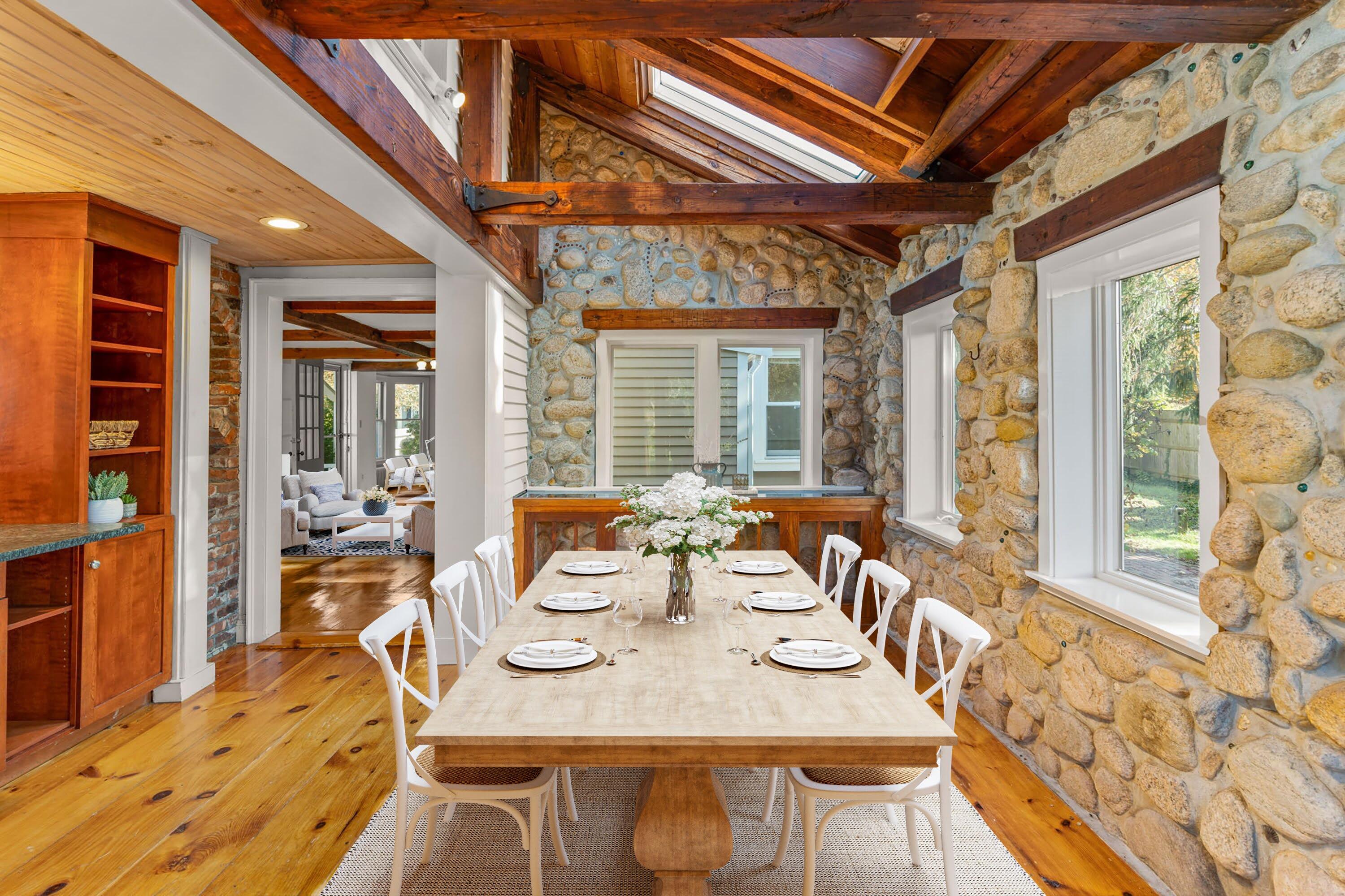 1208 County Road Cataumet, MA 02534 - Photo 10 of 40 a view of a dining room with furniture wooden floor and a chandelier