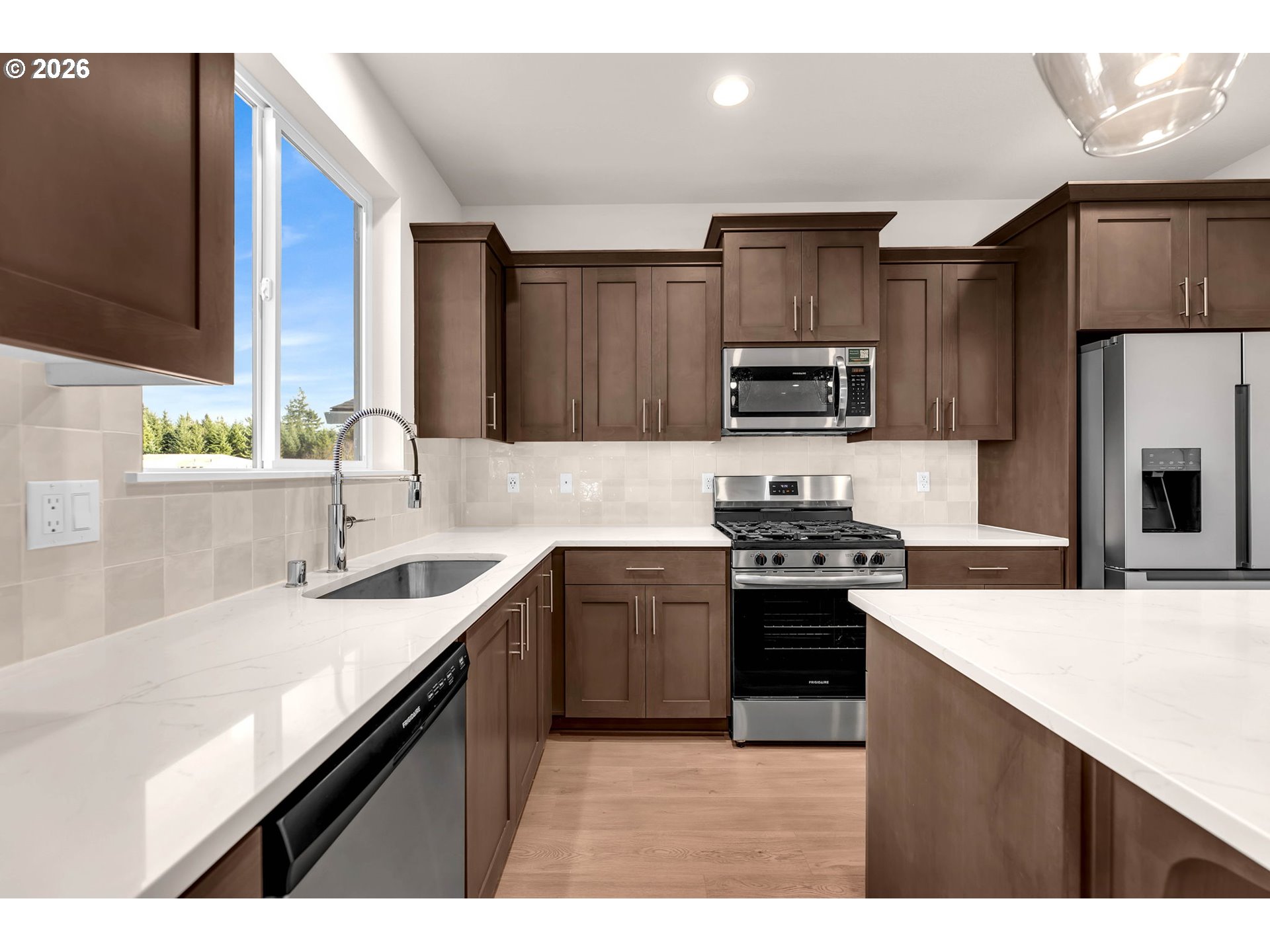 4308 Northeast 185th Street Vancouver, WA 98686 - Photo 13 of 41 a kitchen with a sink stove and refrigerator