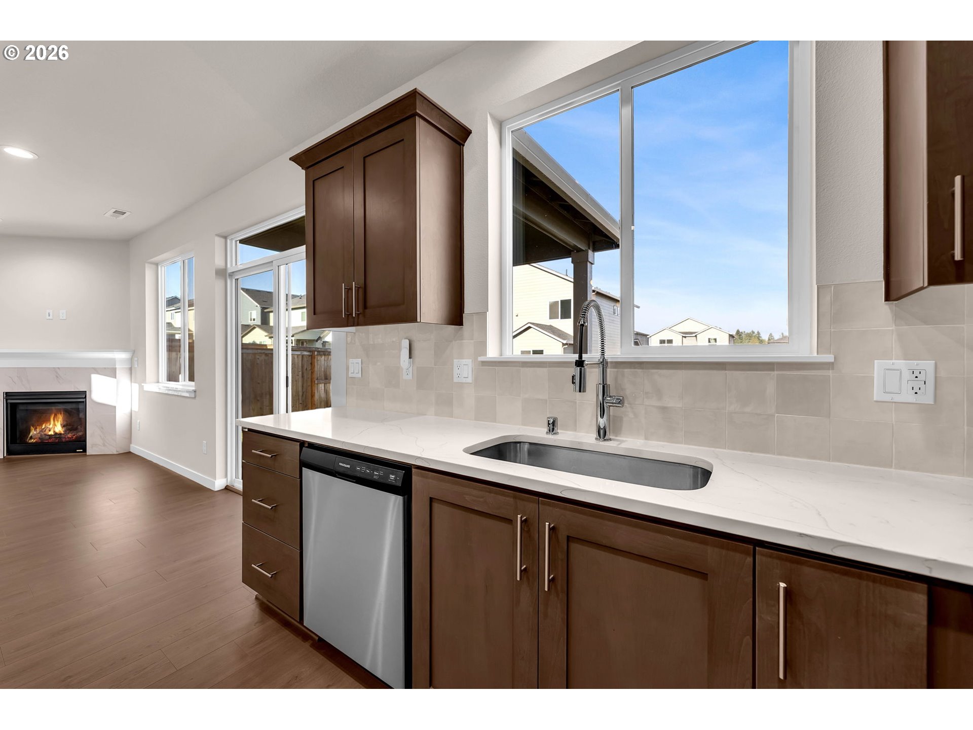 4308 Northeast 185th Street Vancouver, WA 98686 - Photo 16 of 41 a kitchen with a sink cabinets and a wooden floor