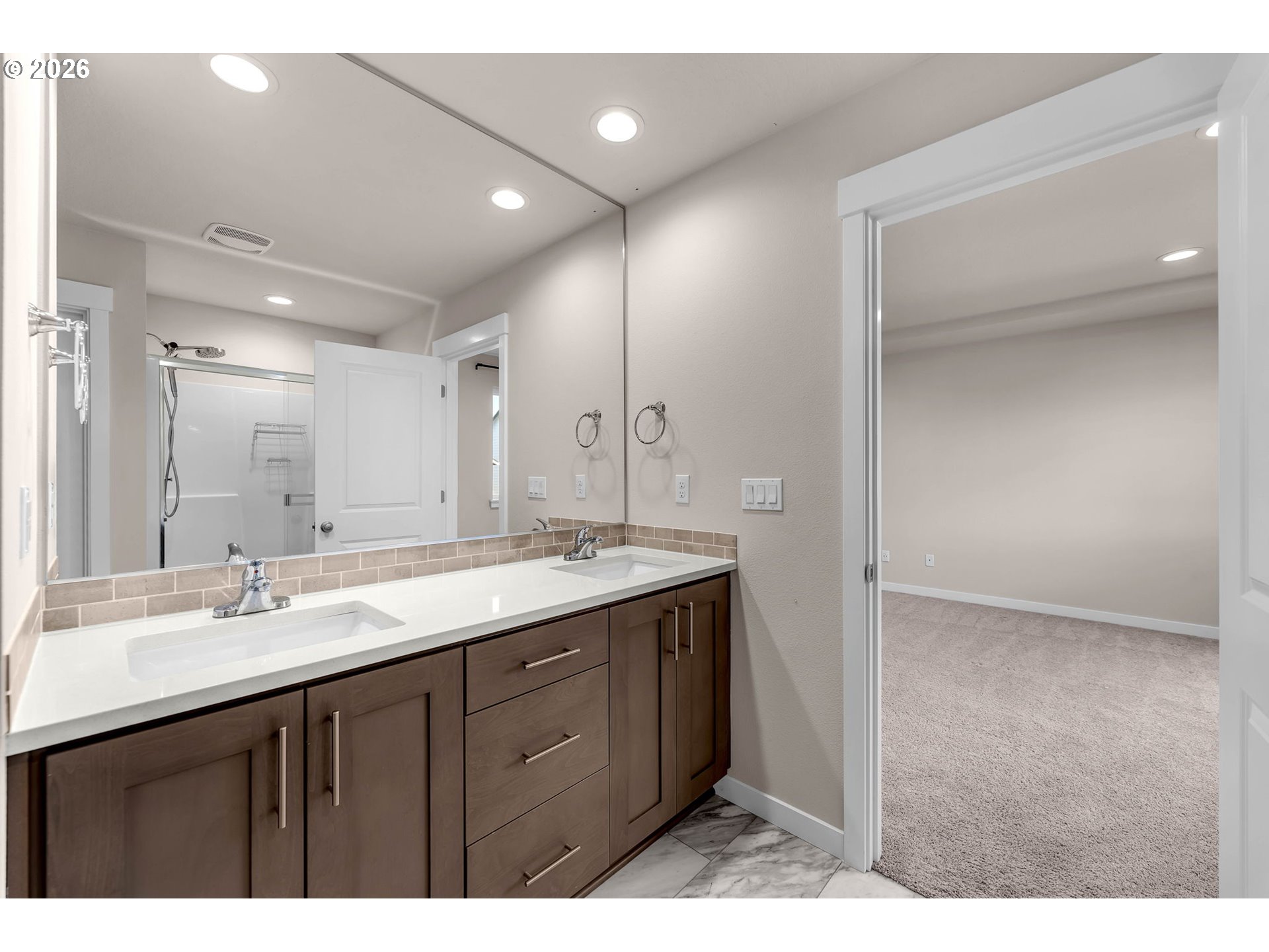 4308 Northeast 185th Street Vancouver, WA 98686 - Photo 30 of 41 a bathroom with a double vanity sink and mirror