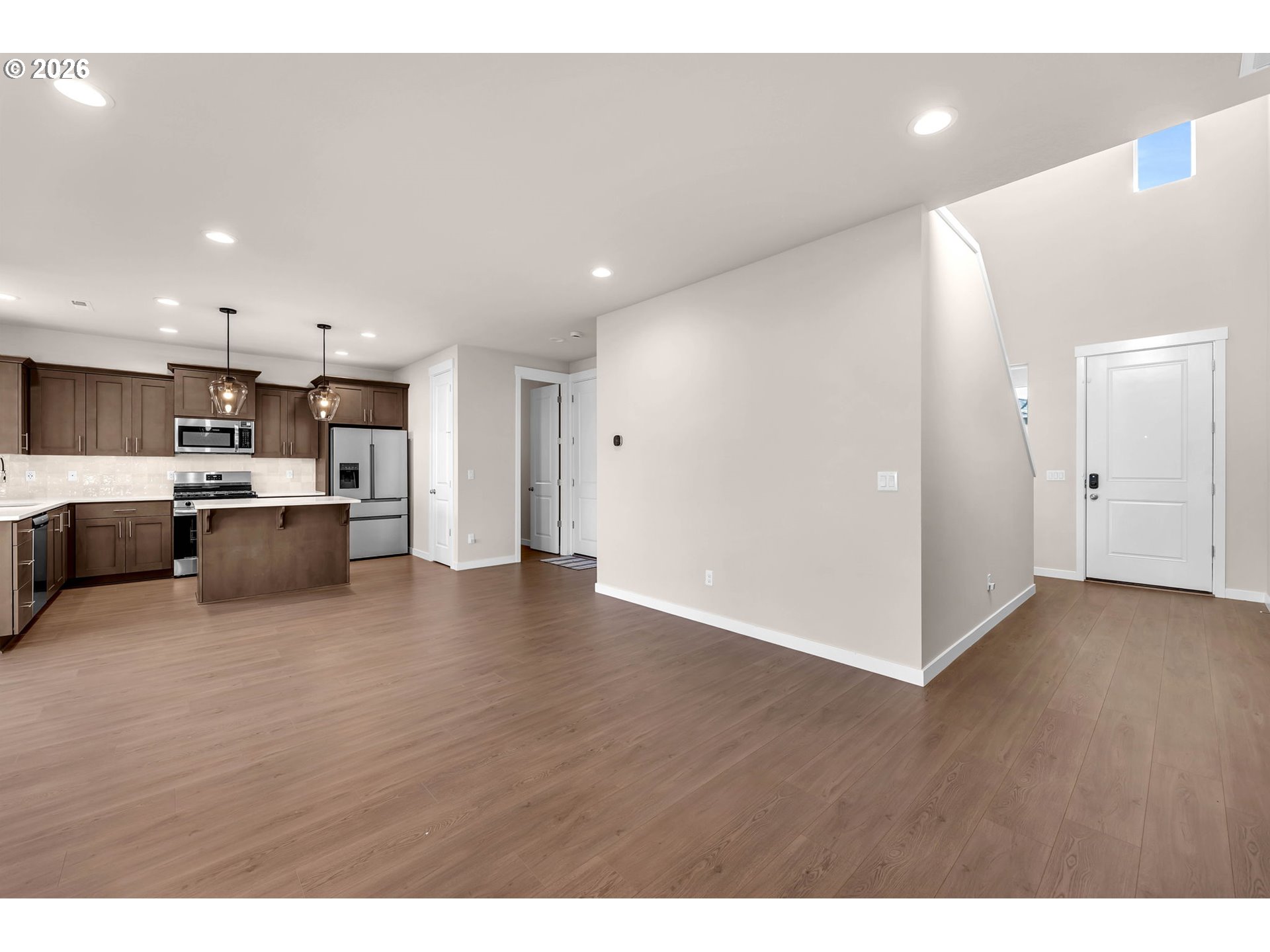4308 Northeast 185th Street Vancouver, WA 98686 - Photo 7 of 41 a view of kitchen with kitchen island a sink wooden floor and stainless steel appliances