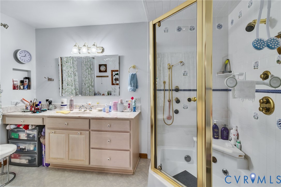 4400 Hacks Neck Road Heathsville, VA 22473 - Photo 38 of 78 a bathroom with a double vanity sink mirror and shower
