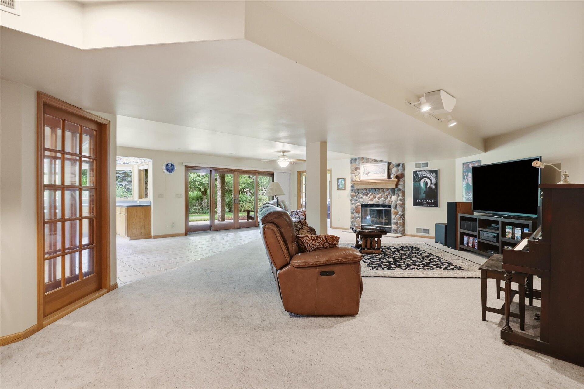 W330-s1417 County Rd C Delafield, WI 53018 - Photo 25 of 39 Gas fireplace, tons of natural light