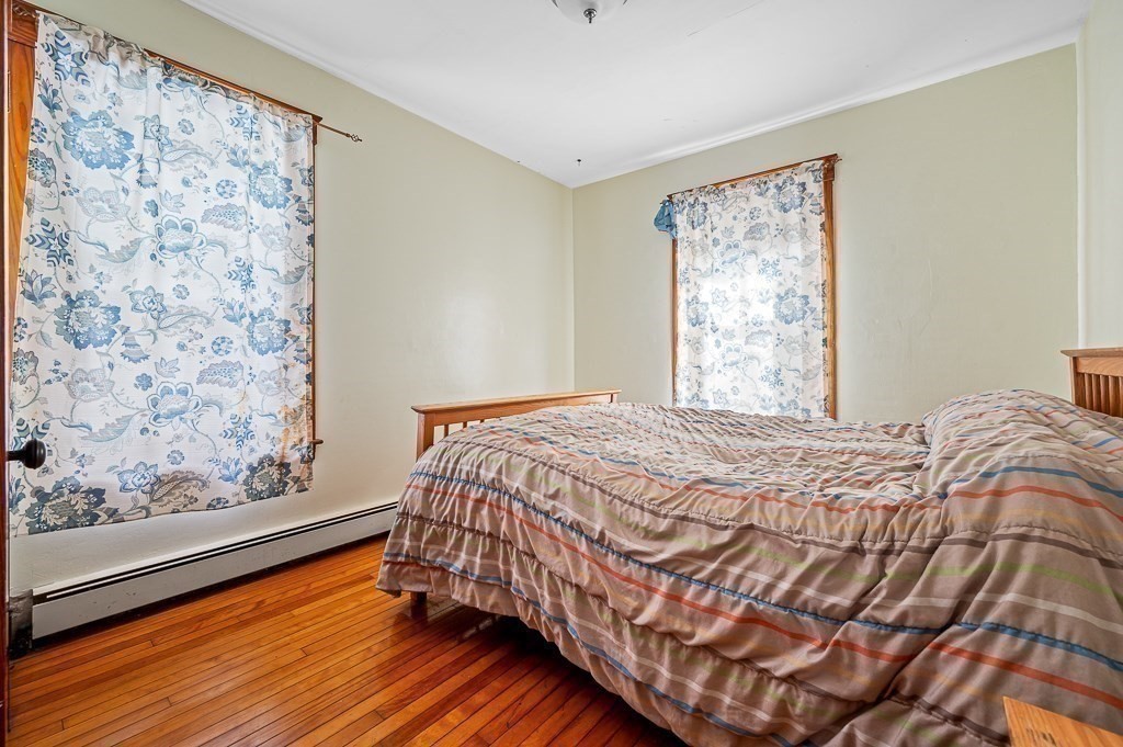 30 Draper Road Gardner, MA 01440 - Photo 15 of 41 a bedroom with a bed and wooden floor