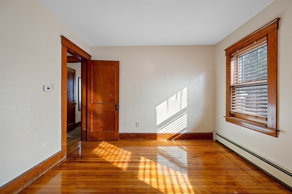 30 Draper Road Gardner, MA 01440 - Photo 27 of 41 a view of an empty room with wooden floor and a window