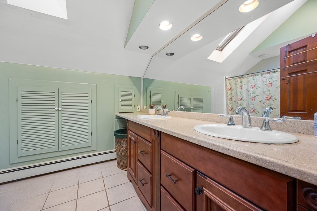 30 Draper Road Gardner, MA 01440 - Photo 30 of 41 a bathroom with a double vanity sink and a mirror