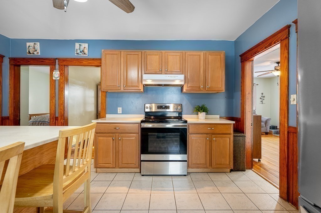 30 Draper Road Gardner, MA 01440 - Photo 6 of 41 a kitchen with a stove a sink and a refrigerator