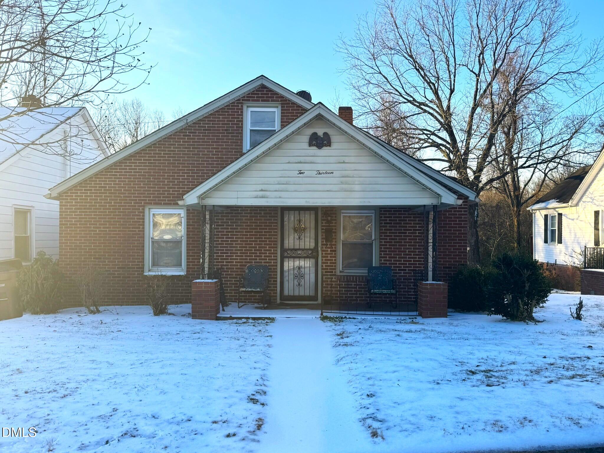 213 Hill Street Roxboro, NC 27573 - Photo 1 of 13 a front view of a house with a yard