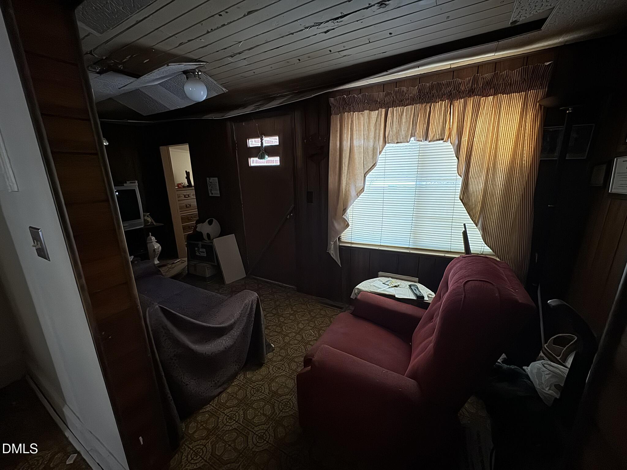 213 Hill Street Roxboro, NC 27573 - Photo 10 of 13 a living room with furniture and a window