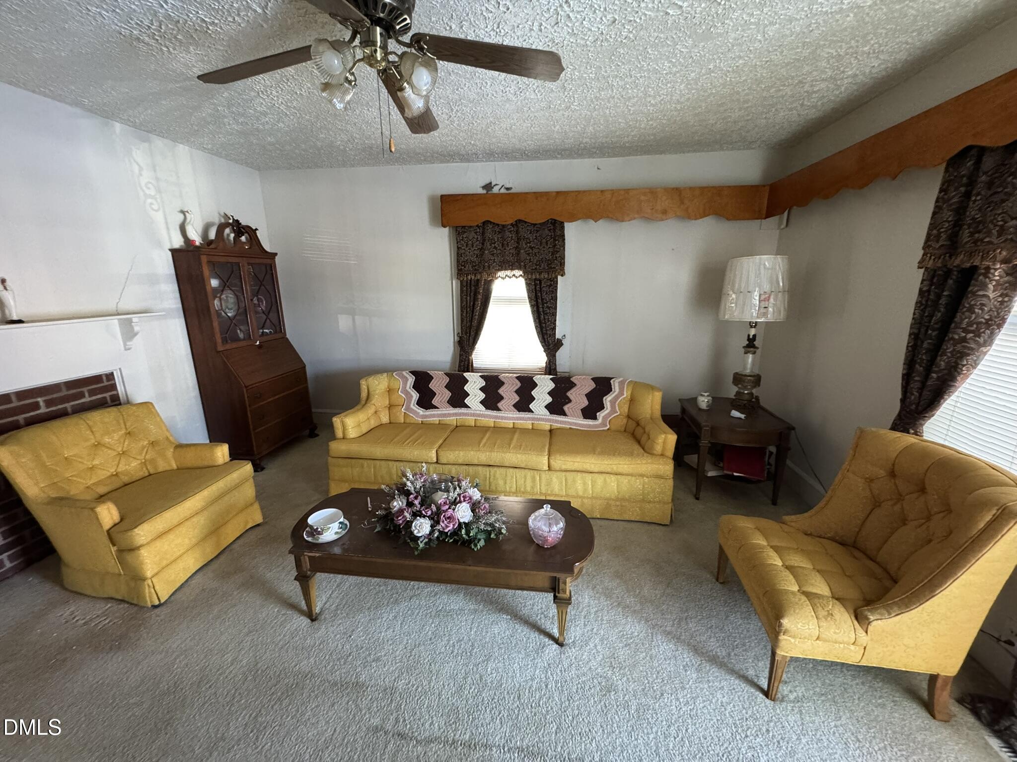 213 Hill Street Roxboro, NC 27573 - Photo 2 of 13 a bed room with furniture and a window