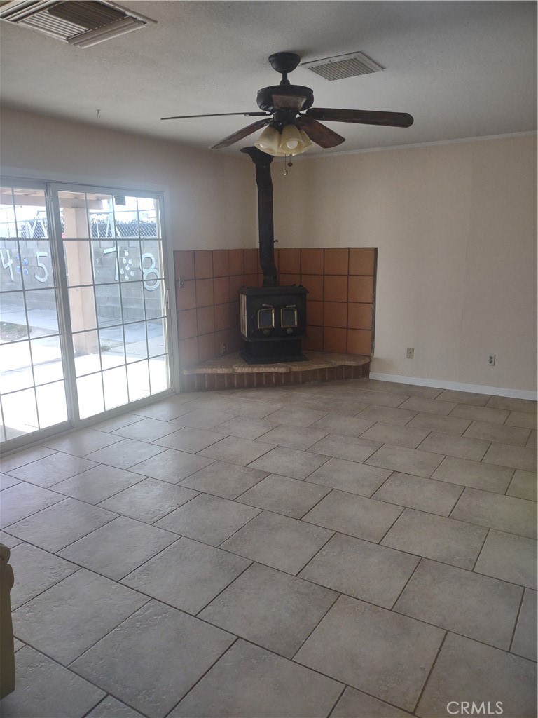 313 Muir Street Barstow, CA 92311 - Photo 4 of 9 a view of an empty room with a window