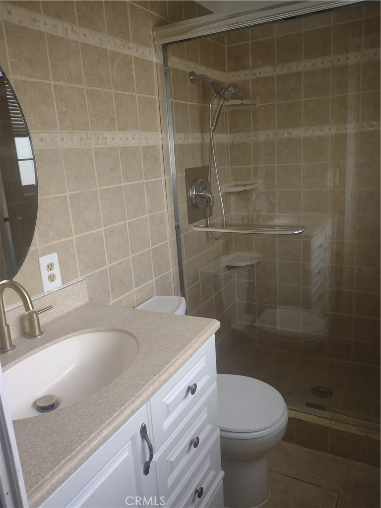313 Muir Street Barstow, CA 92311 - Photo 6 of 9 a bathroom with a sink a toilet and shower