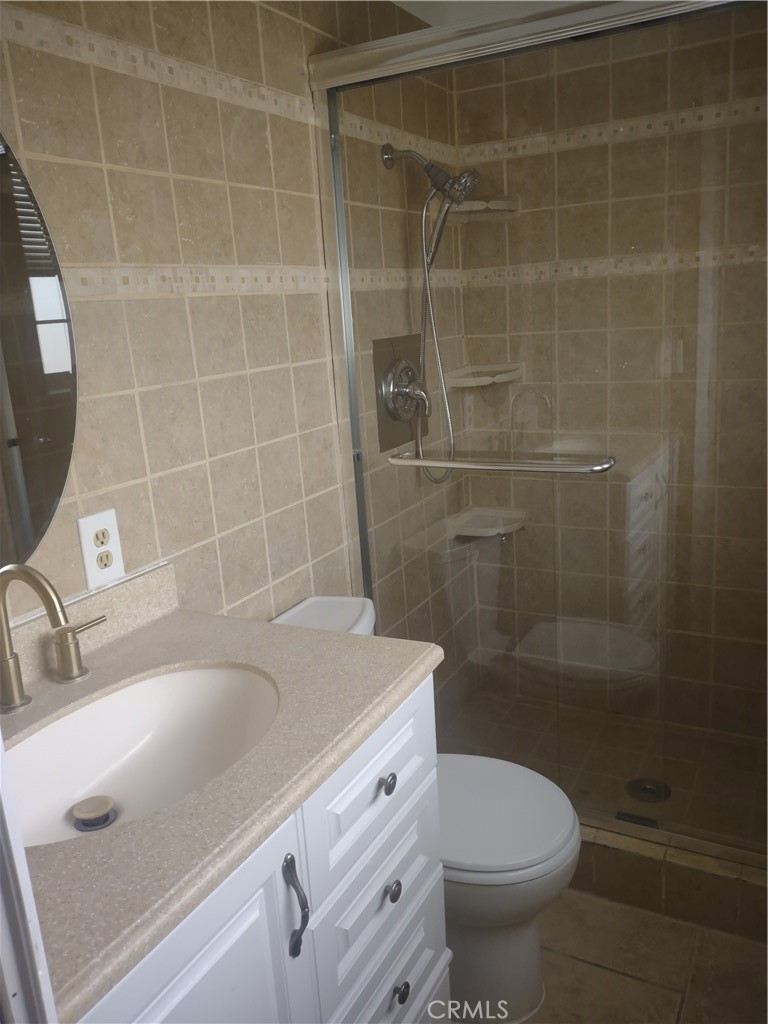 313 Muir Street Barstow, CA 92311 - Photo 9 of 9 a bathroom with a sink a toilet and shower