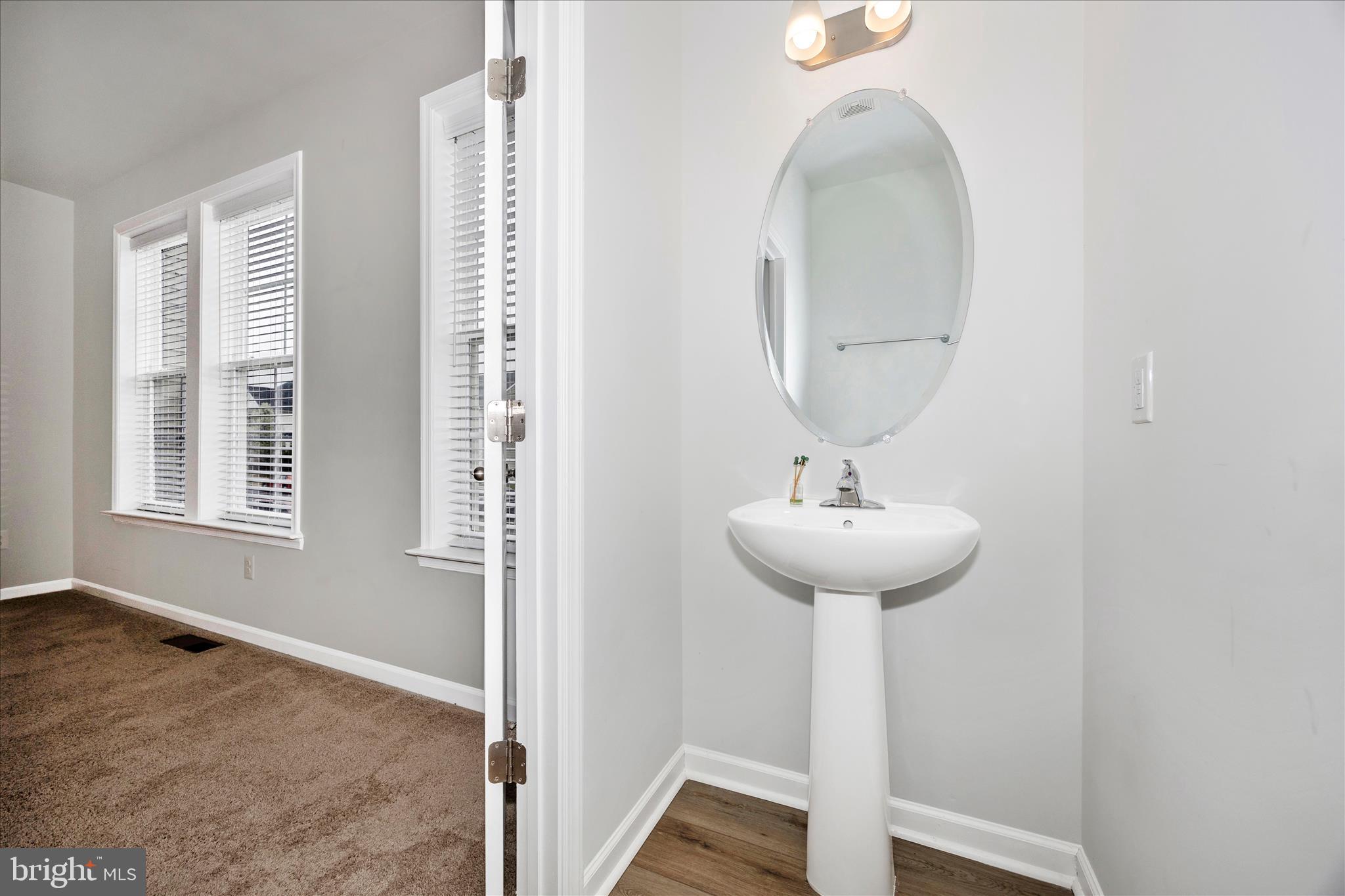 205 Union Ridge Drive Charles Town, WV 25414 - Photo 24 of 56 a bathroom with a sink and a mirror
