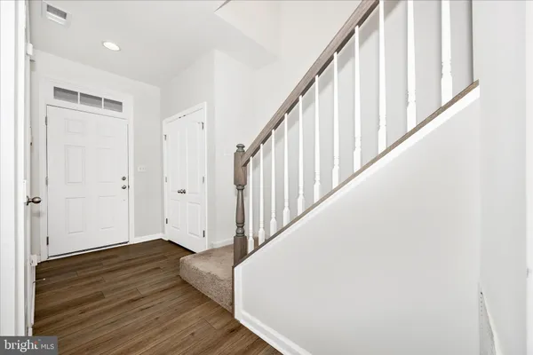 a view of entryway with wooden floor