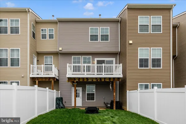 a view of a backyard with plants and a patio