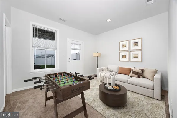a living room with furniture and a window