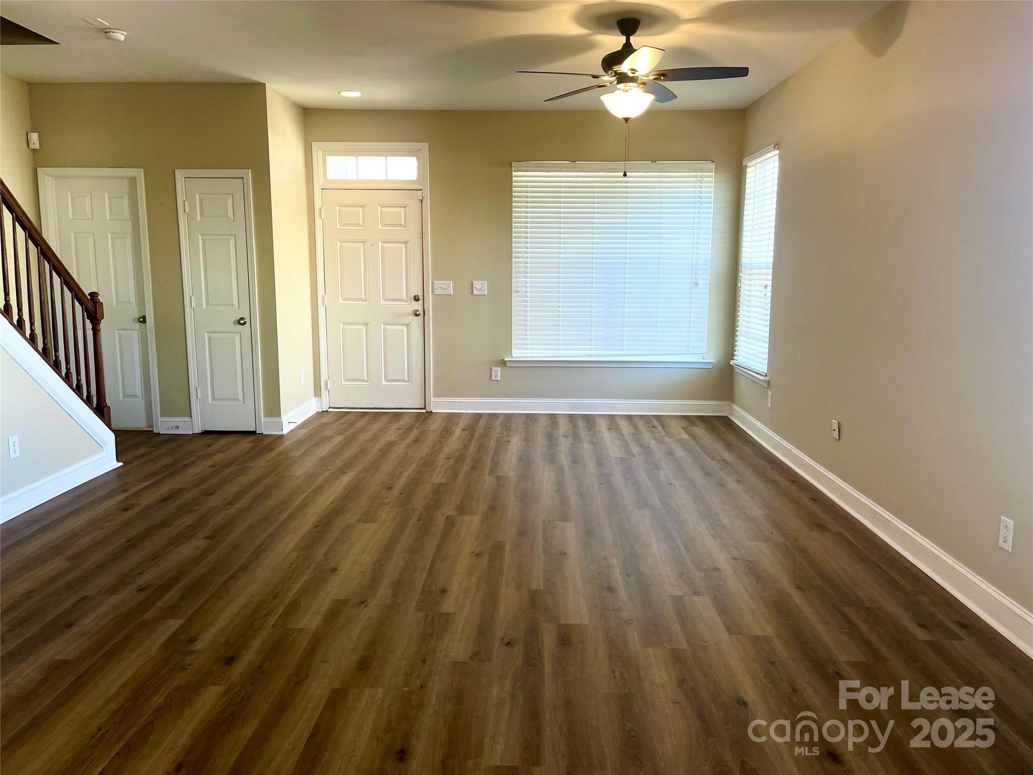 233 East Waterlynn Road, Unit A Mooresville, NC 28117 - Photo 6 of 13 wooden floor in an empty room with a window