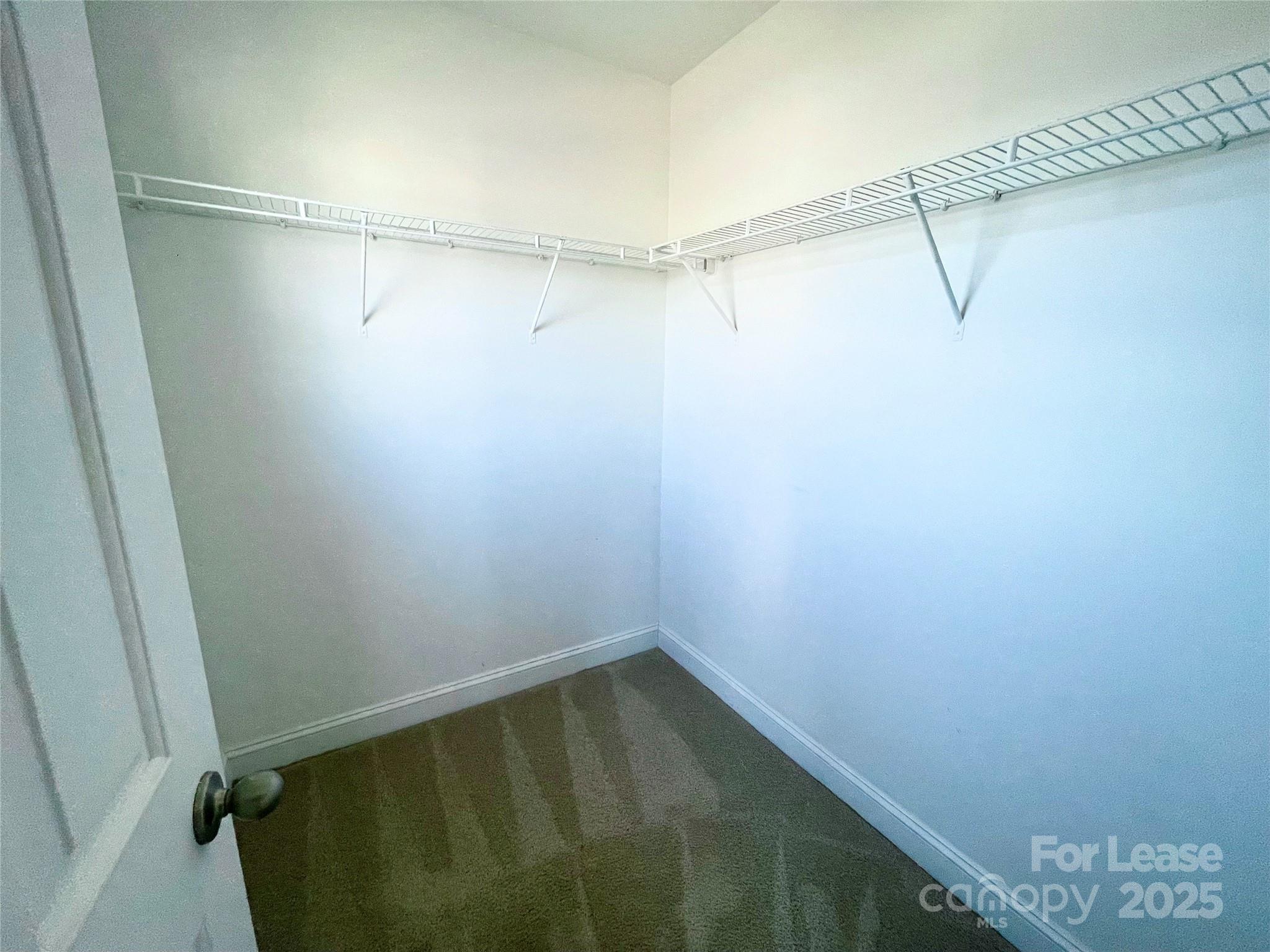 233 East Waterlynn Road, Unit A Mooresville, NC 28117 - Photo 8 of 13 a view of a room with racks on the wall