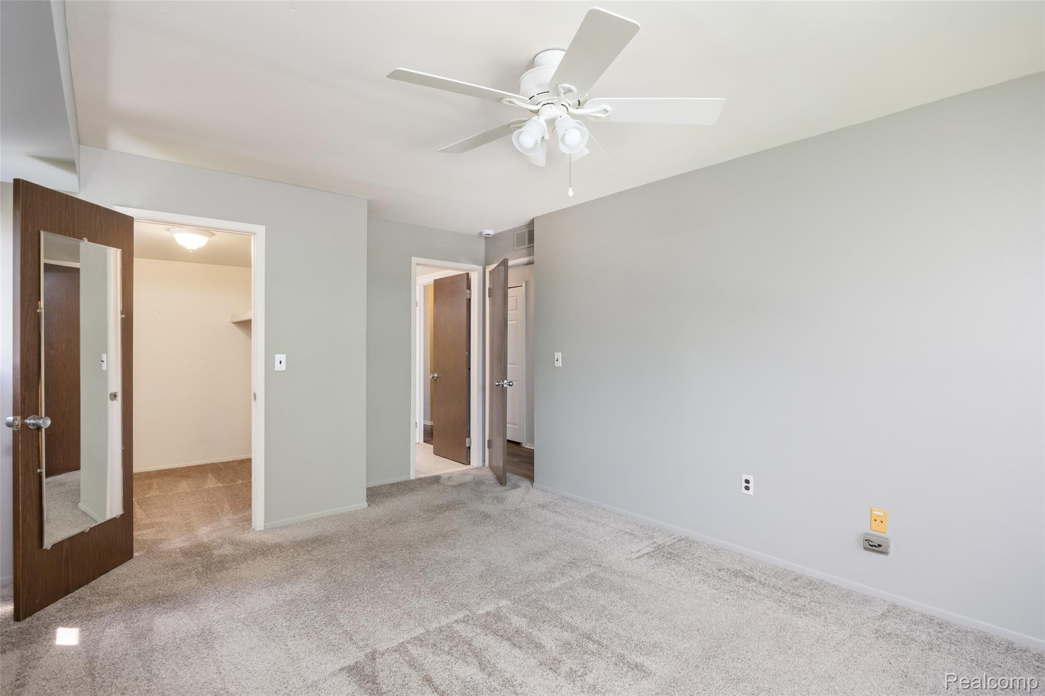 1693 Riverside Drive, Unit 3 Rochester, MI 48309 - Photo 14 of 25 Light filled primary bedroom with larger walk-in closet