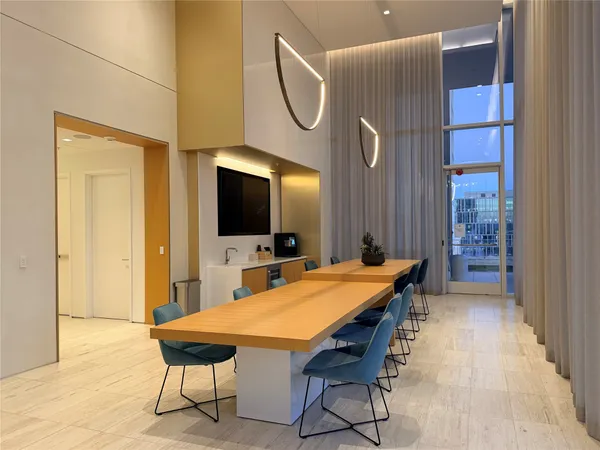 a living room with furniture and a mirror